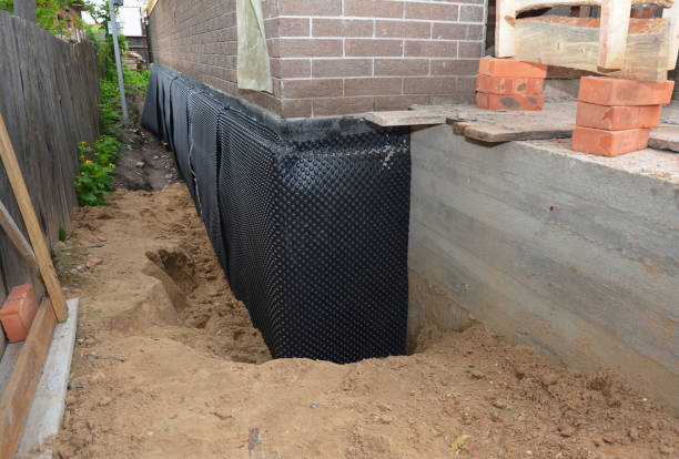 SJ Waterproofing Pros technician performing targeted Interior Drainage System assessment in Litchfield, MI